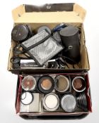A collection of assorted 35mm camera lens hoods, lens filters, optical filters, Russian MIR-1 2.