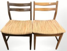 A pair of 20th century teak dining chairs.