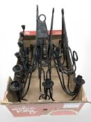 A group of wrought metal wall candle sconces