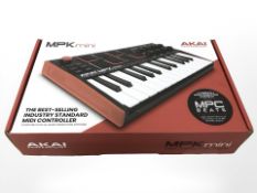 An Akai Professional MPK mini midi controller,