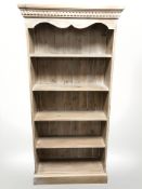 A modern washed pine open bookcase,