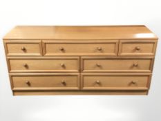 A G Plan teak seven drawer low chest, 150 cm x 48 cm x 69 cm.