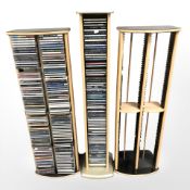 Three CD towers containing assorted CDs.