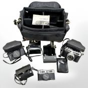 Three Yashica Electro 35 35mm cameras with Color-Yashinon DX 1:1.