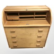 A teak cylinder bureau,