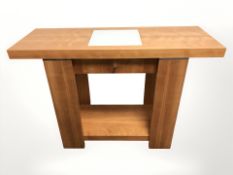 A modern side table with glass inset top 110 cm x 40 cm x 75 cm
