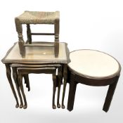 A nest of three tables, a rattan stool and a melamine inset circular table.