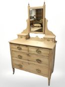 A late Victorian pine four drawer mirror backed dressing table,