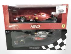 A Hotwheels 1:18 scale Ferrari 150 Italia F1 car and further minichamps 1:18 scale Mclaren F1 car,