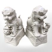 A pair of reproduction Chinese ceramic temple dogs,