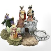 A Royal Doulton Bunnykins 'The Arthurian Legends' display stand containing figurines, Merlin,