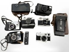A quantity of pocket 35 mm cameras including Minolta 24 Rapid, two Ricoh 500 ME cameras,