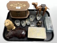 A group of collectables including leather camel figure, wooden carved Hippo, antique glass bottle,