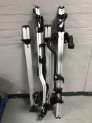 A Thule car roof rack with keys