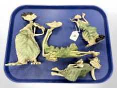 Four anthropomorphic characters wearing leaf clothing, tallest 24 cm.