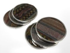 Six Peruvian silver mounted coasters, each 7.5 cm diameter.