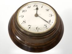 A walnut case Zenith circular eighteen day wall timepiece, diameter 21 cm.