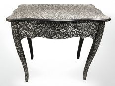 A contemporary silvered serpentine front side table fitted a drawer,