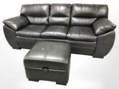 A contemporary black stitched leather three seater settee, length 225 cm,