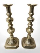 A large pair of brass candlesticks,