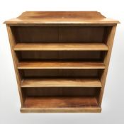 A walnut open bookcase, 99 cm x 25 cm x 113 cm.