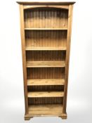 A modern pine open bookcase,