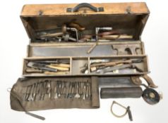 An early 20th century pine joiners toolbox containing carpentry tools.