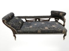 An early 20th century mahogany chaise longue, length 187 cm, and matching armchair.