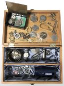 A two division box containing Crowns and other coins, police badges, medal, lady's Avia wristwatch,