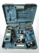 A Makita 6336D power drill, in case with accessories.