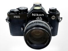A Nikon FM2 35mm camera with Nikkor 50mm 1:1.8 lens and 52mm Nikon filter.