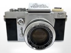 A Beseler Topcon Super D 35mm camera with RE.Auto-Topcor 1:1.8 f=5.8cm lens, RE.Auto-Topcor 1:3.