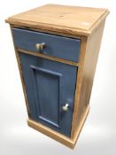 A modern pine pot cupboard,