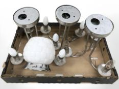 A set of three brushed steel chandeliers,