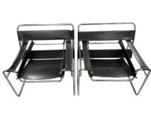 A pair of contemporary chrome and black stitched leather lounge chairs,