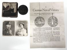A re-strike Lusitania medal and related document,