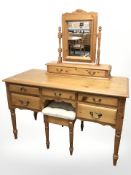 A modern pine five drawer dressing table with mirror above and a footstool, 123 cm x 54 cm x 143 cm.