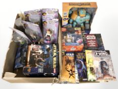A group of boxed figurines including Dora the Explorer, Star Wars guides and similar items.