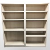 A pair of modern open bookcases,