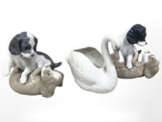A Nao swan dish and two Nao figure groups of puppies playing,