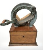 A walnut table box and a Danish Raadvad enameled metal bread slicer.