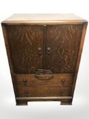 A 1920's oak linen cupboard,