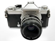 A Nikkormat 35mm camera with Nikkor 50mm 1:2 lens.