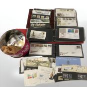 Three albums of first day covers and further loose examples, tin of loose stamps, etc.