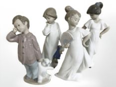 A group of four Nao figures, boys and girls,