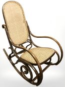 A bentwood and cane rocking chair.