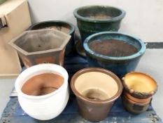 A group of earthenware plant pots