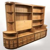 A Nathan teak four piece sideboard comprising of two open bookcases and two corner shelves,