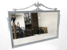 A reproduction silvered mirror, width 98 cm.