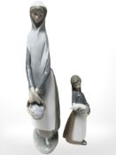 A Lladro figure of a lady holding a basket of apples and further figure of a girl holding a piglet